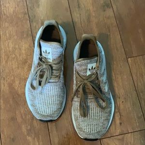 Adidas Otholite tennis shoes.